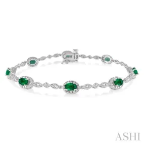 5x3MM Oval Cut Emerald and 1/20 Ctw Single Cut Diamond Bracelet in 10K White Gold