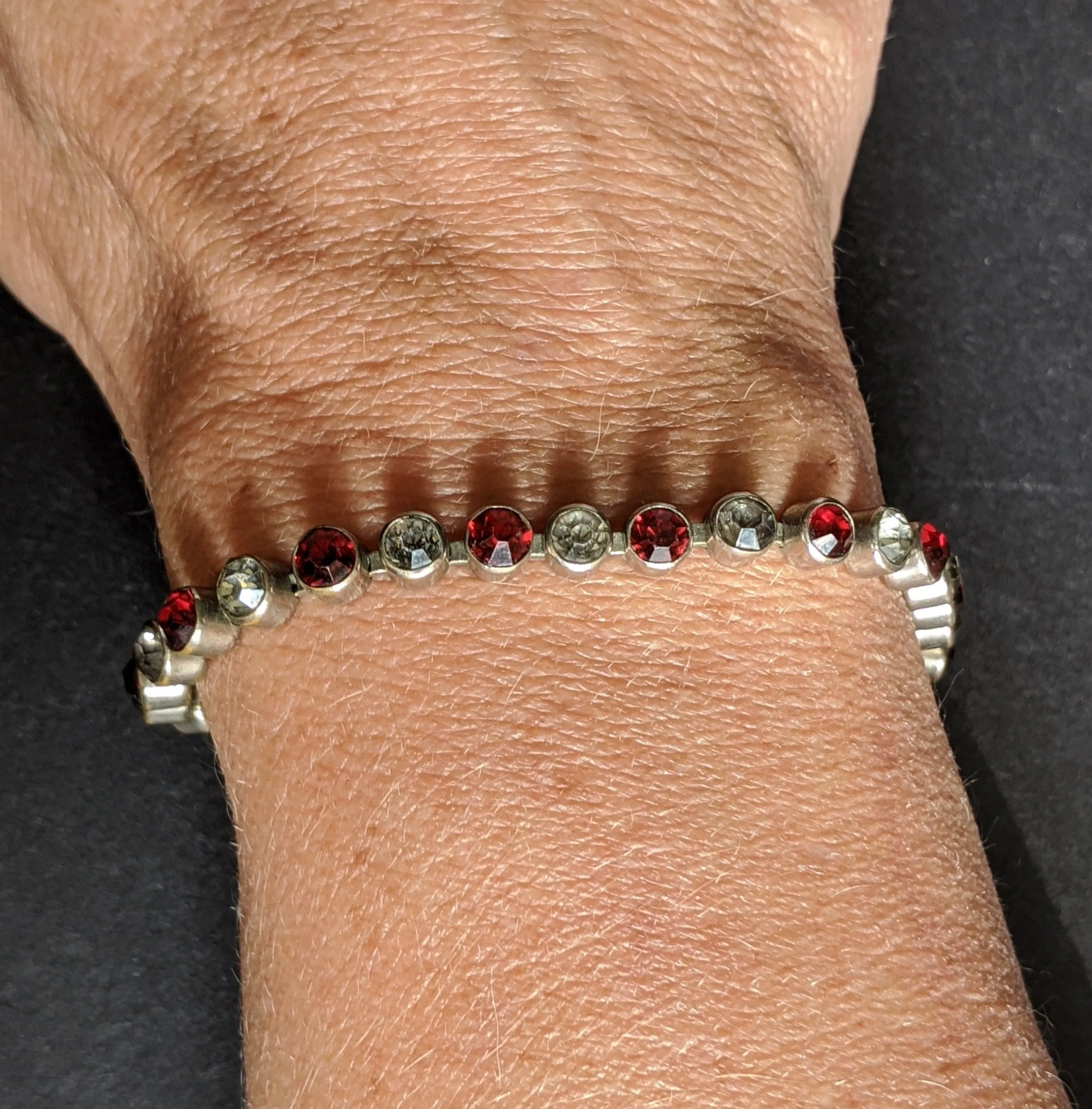 Vintage 1930s Art Deco collet set bright ruby red and clear rhinestone and silver tone tennis / cocktail bracelet